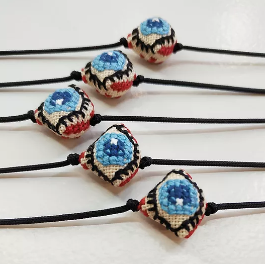 Mati with black cord