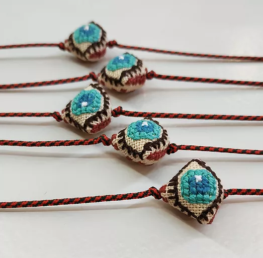 Mati with red cord